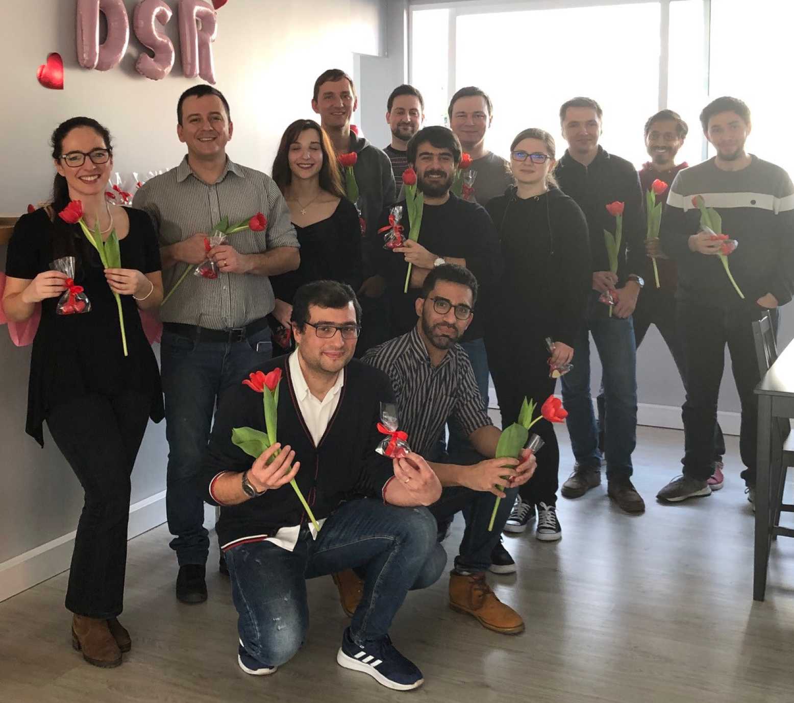 Porto office team holding tulips